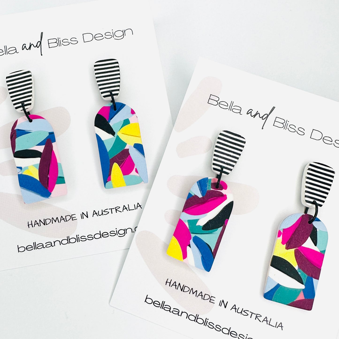 Chloe // Rainbow Leaves // Clay  Dangle Earrings // Yellow, Blues, Green, White, Black, Fuchsia and Stripes